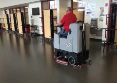 Compact scrubber dryer cleaning school